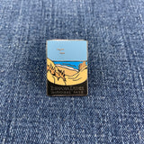 Pin with Indiana Dunes National Park design on a denim background