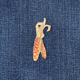 Embroidered corn on the cob patch on denim fabric