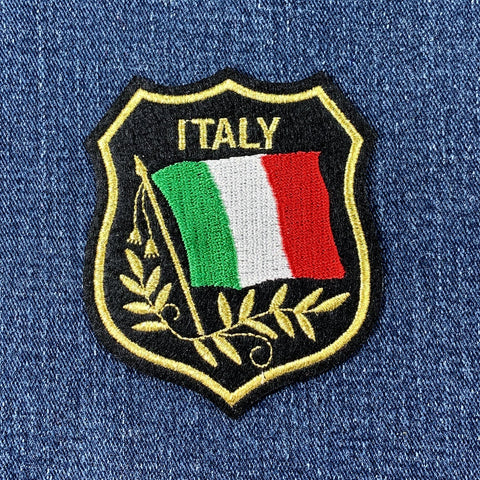 Embroidered patch with Italian flag and 'ITALY' text on a denim background