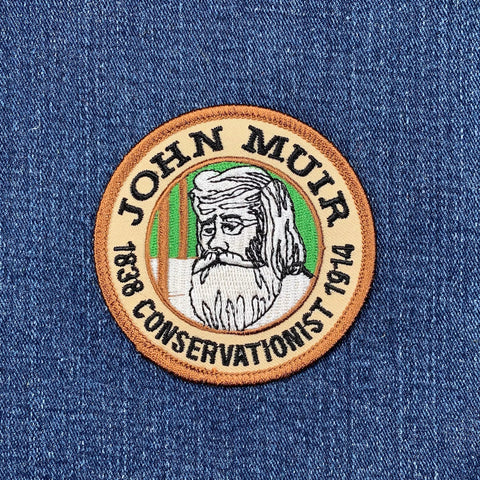 Patch with John Muir's face and text on a denim background