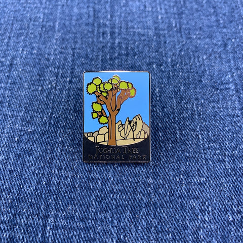 Pin with Joshua Tree National Park design on a blue denim background