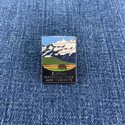 Pin with Katmai National Park and Preserve design on a denim background