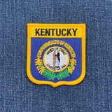 Kentucky state patch on a blue denim background