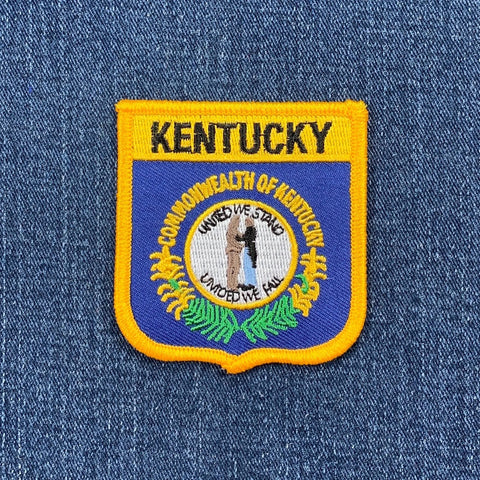 Kentucky state patch on a blue denim background