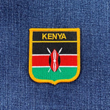 Kenyan flag patch on a blue denim background