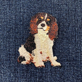 Embroidered king Charles cavalier dog patch on denim fabric