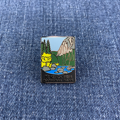 Pin with a scenic design of a kings canyon national park mountain and trees on a denim background
