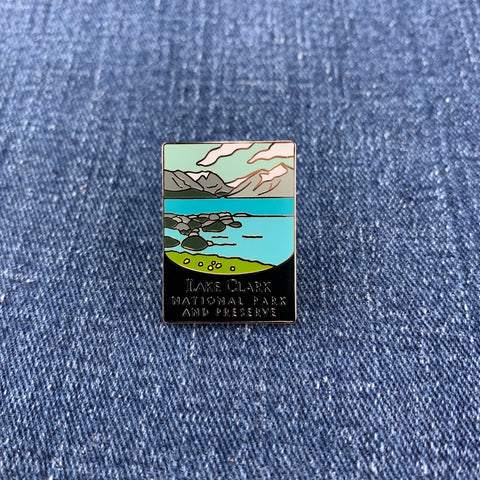 Pin with Lake Clark National Park design on a denim background