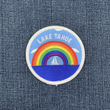 Patch with rainbow and 'Lake Tahoe' text on denim fabric