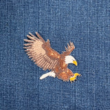 Embroidered eagle applique on denim fabric