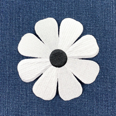 White daisy flower patch on a denim background