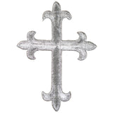 Decorative silver cross patch on a white background