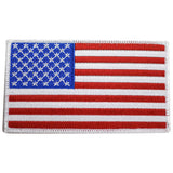 A large American flag patch with a white border.