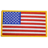 A large American flag patch with a yellow border.