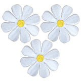 Three embroidered patches depicting white daisy flowers with yellow centers, arranged in a triangular formation.