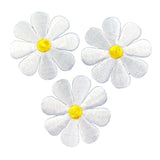 Three white embroidered daisy flowers with bright yellow centers, arranged on a plain white background.
