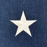 White star patch on a blue denim background