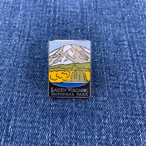 Pin with Lassen Volcanic National Park design on a blue denim background