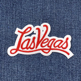 Embroidered patch with 'Las Vegas' text on denim fabric