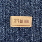 Microfiber patch with 'LET'S BE IRIE' text on a denim background
