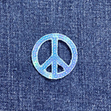 peace symbol patch on denim fabric