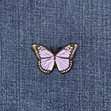 Lilac purple butterfly patch on denim fabric