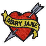 a heart shaped patch with an arrow through it with the words 'MARY JANE' in the center on a white background
