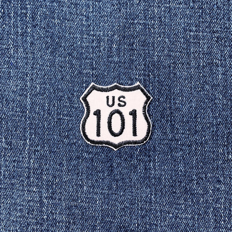 US Route 101 patch on blue denim fabric