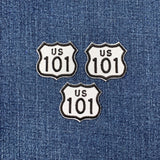 Three US Route 101 patches on a denim background