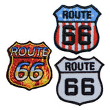 Three 'ROUTE 66' patches in different colors on a white background