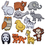 A collection of twelve small, embroidered animal patches including a rabbit, a brown bear, an elephant, a seal, a wolf, an owl, a yellow chick, a zebra, a panda, a tiger, a giraffe, and a monkey.