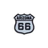 An embroidered patch shaped like the Arizona Route 66 shield, featuring black embroidered lettering and numbers on a white background with a black stitched border.