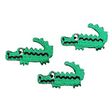 Three green crocodile-shaped patches on a white background