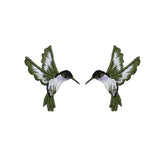 Two embroidered hummingbird patches on a white background