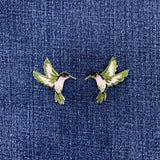 Pair of hummingbird patches on a denim background