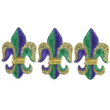 Three Fleur de Lis applique patches in green, gold, and purple Mardi Gras colors with an iron-on application