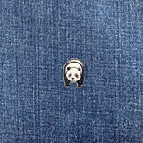 Panda-shaped patch on a denim background