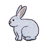 Embroidered patch of a white rabbit on a white background