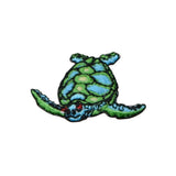 Embroidered patch of a green and blue turtle on a white background