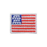 A mini American flag applique patch with an 'iron on' backing, featuring a blue field with white stars and a red border.