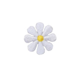 White flower patch with a yellow center on a white background