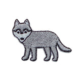 Embroidered patch of a gray wolf on a white background