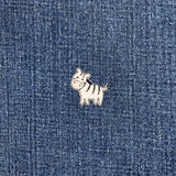 Small zebra patch on a denim background