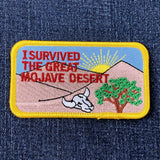 Patch with desert scene and text 'I Survived the Great Mojave Desert' on denim background