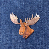 moose head patch facing right on a denim background