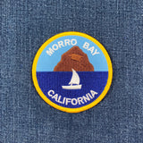 Patch with 'Morro Bay, California' text and scenic design on denim fabric