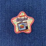 Star-shaped patch with 'Movie Night' text and a television graphic on denim fabric.
