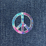 Multicolored sequin peace symbol patch on denim fabric