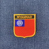 Embroidered patch of the Myanmar flag on a denim background