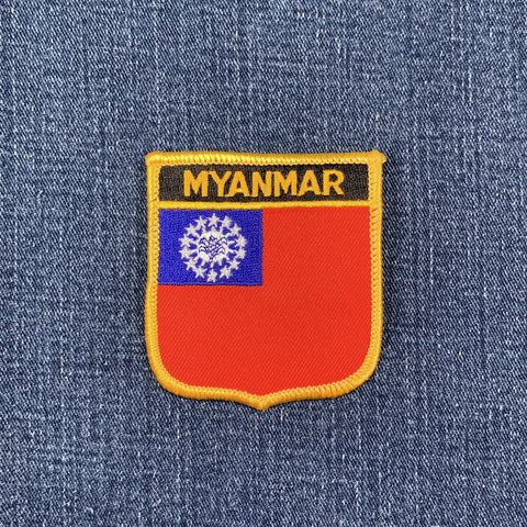 Embroidered patch of the Myanmar flag on a denim background